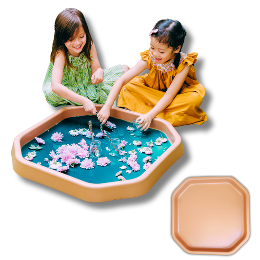 Children playing with brown TUFF TRAY containing water and flowers for sensory learning