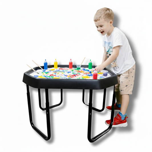 Child playing with Small TUFF PLAYtray and adjustable stand featuring paint supplies and sensory play surface
