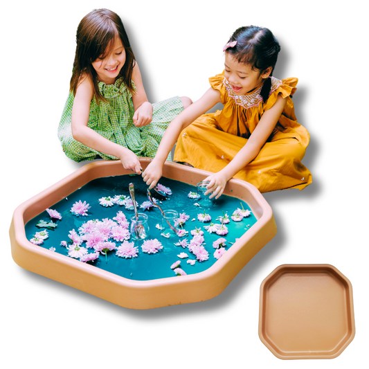 Small brown TUFF TRAY with children engaging in sensory water play, featuring flowers and educational activities.