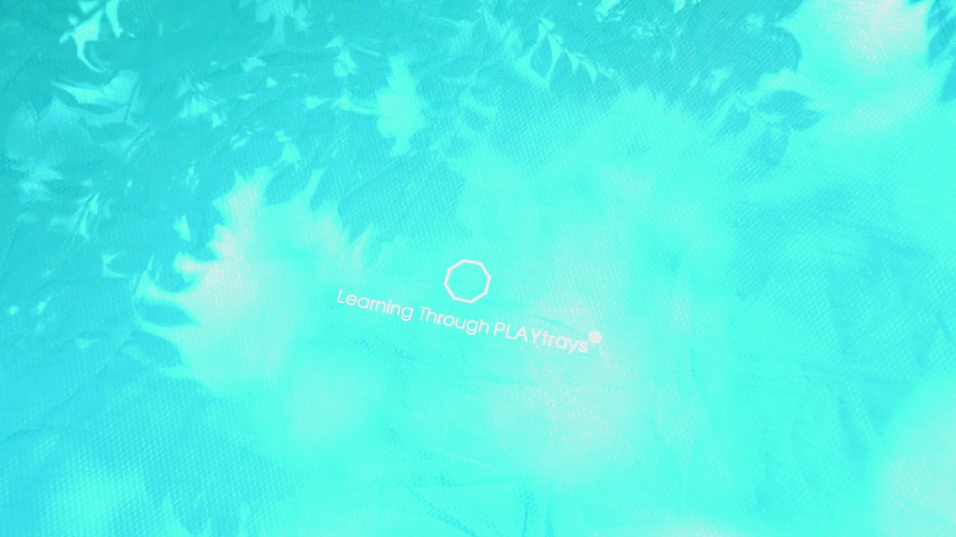 Blue cover protecting sand sensory play in Tuff Tray