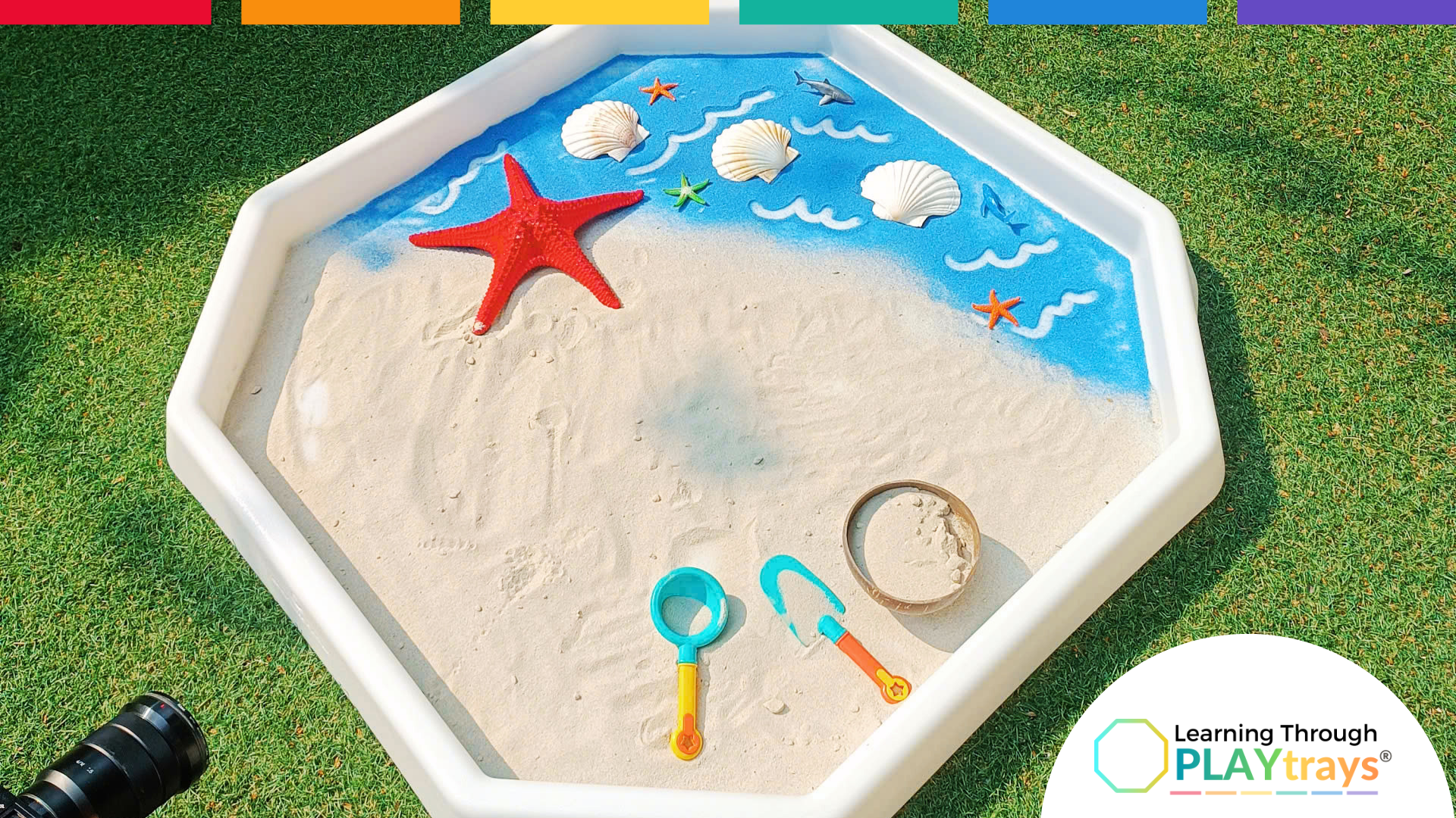 large white tuff tray video setup with sand and water 