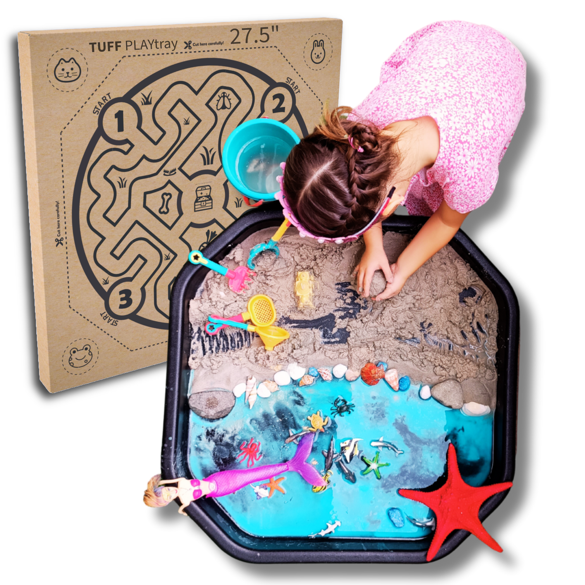 Child playing beach sensory activity in small black Tuff Tray with product box in background
