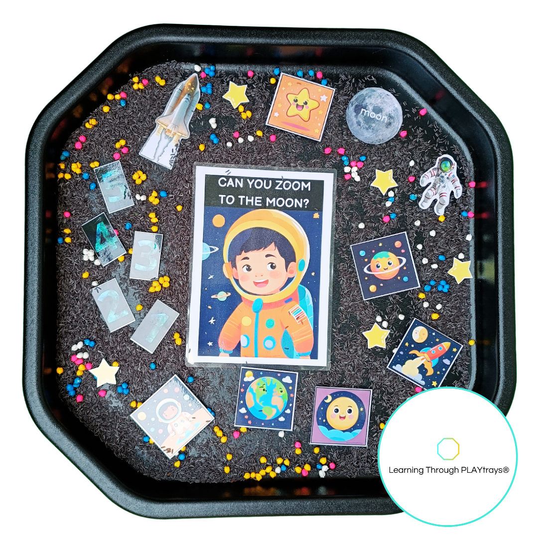 Educational play tray with space-themed cards and decorations for space themed tuff tray 